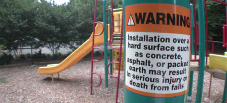 Warning sticker on playground equipment